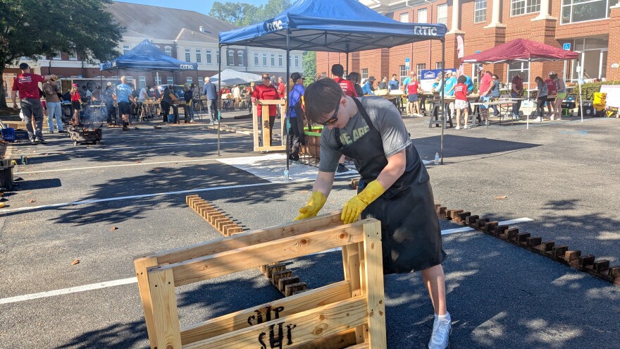 Saturday's bed build in the Kimley-Horn office parking lot resembled an open-air furniture factory.