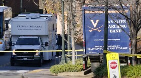 A Virginia State Police crime scene investigation truck is on the scene of an overnight shooting at the University of Virginia, Monday, Nov. 14, 2022, in Charlottesville. Va. (AP Photo/Steve Helber)