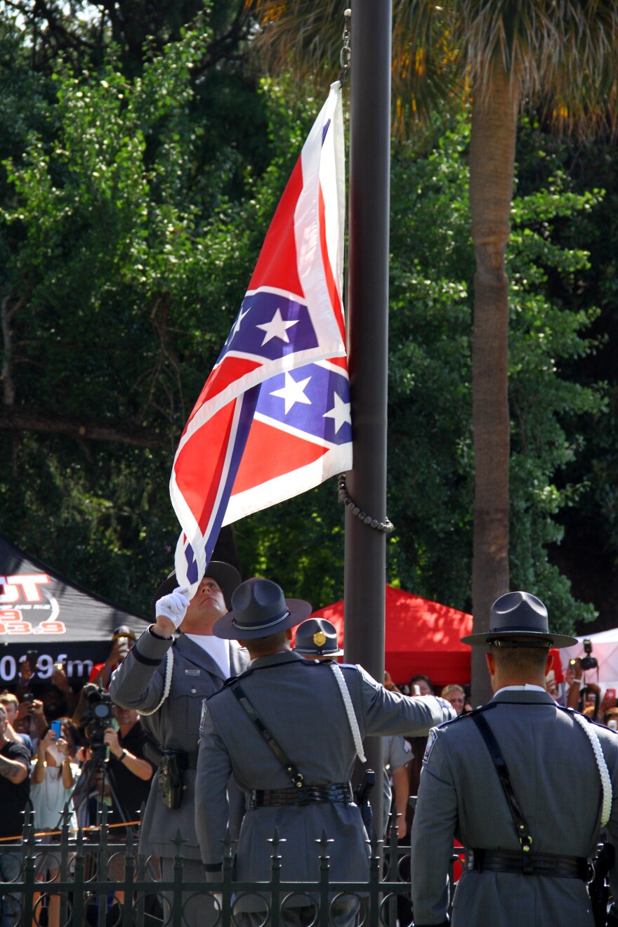 South Carolina State Police remove the Confederate flag from the Statehouse grounds. 