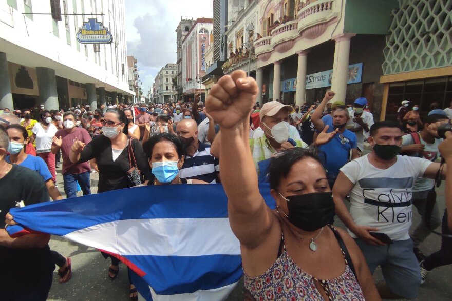 NO TENEMOS MIEDO Cubans march through Havana on Sunday protesting their communist regime in nationwide demonstrations of unprecedented size and anger.