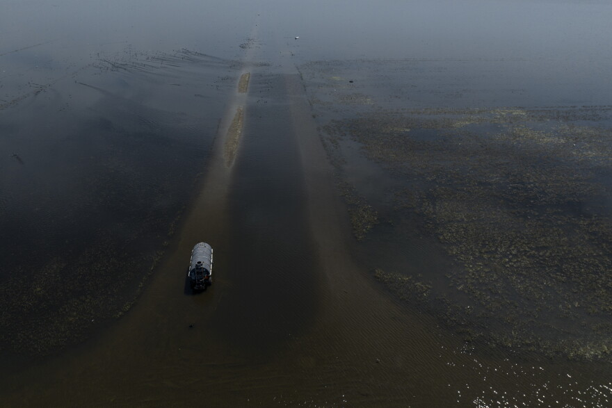 Farmland in the Tulare Lake Basin is submerged in water in Corcoran, California, Thursday, April 20, 2023, after more than a dozen atmospheric rivers dumped record-setting rain and snowfall.