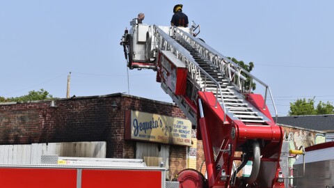    Firefighters put out "hot spots" remaining after a fire destroyed south side Columbus grocery store Jequeta's #2.