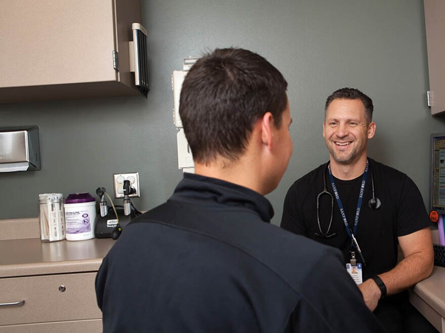 Dr.-Joshua-Crabtree-with-patient-12-08-2015.jpg