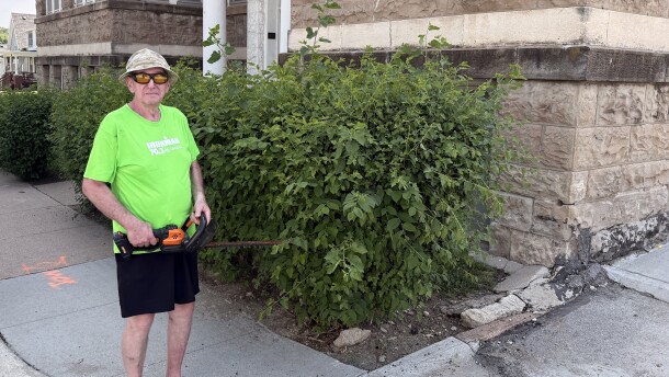 Chuck Martens poses for a photo in front of his apartment complex on June 6, 2026, in Omaha, Nebraska. He landscapes the complex property in exchange for a reduction in rent.