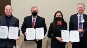 Colorado Governor Jared Polis (far left), stands with Secretary of Agriculture Tom Vilsack (center left), Secretary of the Interior Deb Haaland (center right) and Idaho Governor Brad Little (far right).