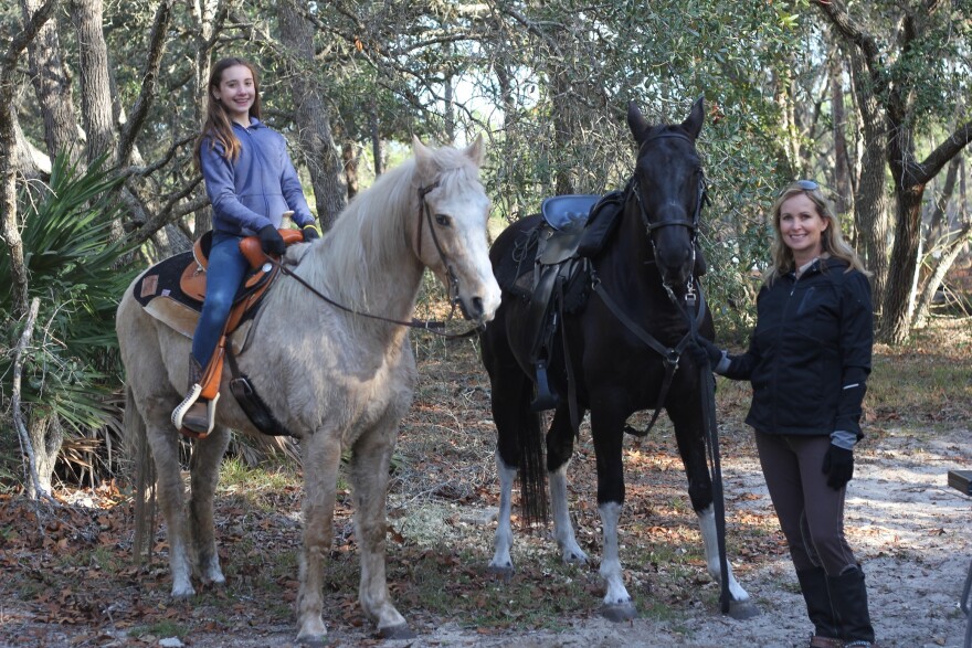 Katana Herbenick and her mother, Laurie Herbenick, with horses Marshall and Flicka