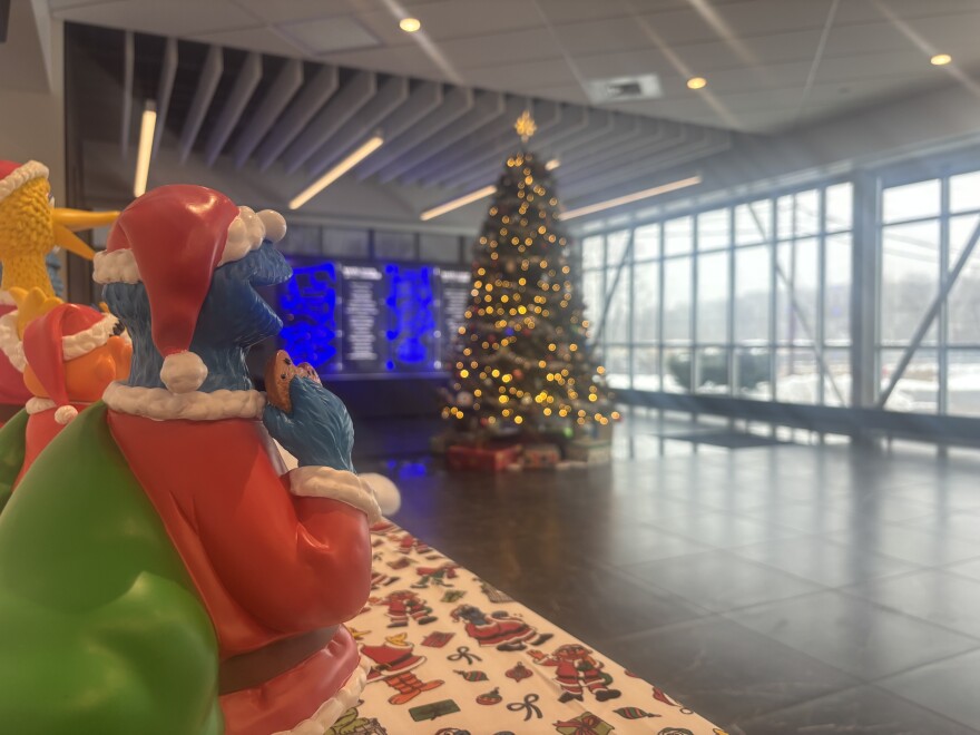 Cookie Monster looks at the WVIA Christmas tree.