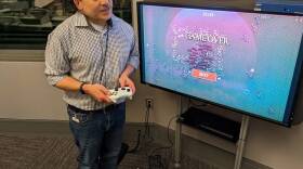 Here & Now's Scott Tong plays Vampire Survivors. (James Mastromarino/Here & Now)