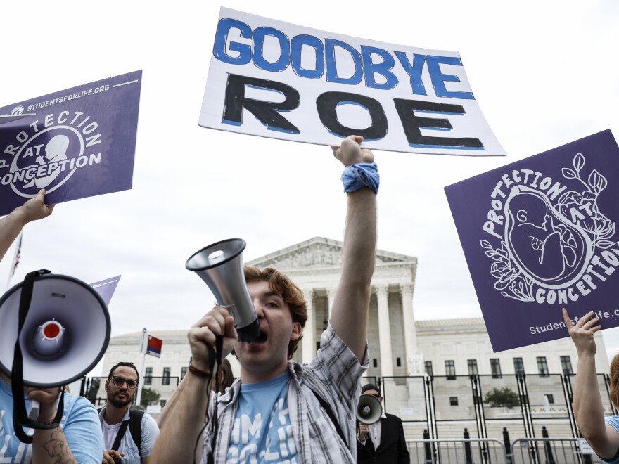 Anti-abortion rights activists protest outside of the U.S. Supreme Court on Tuesday in Washington, D.C.