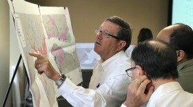 City Councilman Jim Love (a new member of the AAA Working Group) looks at a floodzone map of downtown Jacksonville.