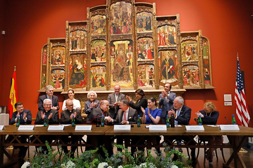 Archbishop of Santiago de Compostela Francisco José Prieto Fernández of Spain, center left, shakes hands with SMU President Jay C. Hartzell, center right, after a signing ceremony at the Meadows Museum, Tuesday, Oct. 7, 2025, in University Park, to collaborate in a major exhibition coming to the museum in February 2027.