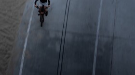 A boy rides an e-bike in Santa Monica, Calif., Monday, Aug. 10, 2026.
