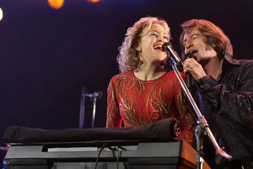 (L to R) Kate Hudson as Claire Sardina and Hugh Jackman as Mike Sardina in director Craig Brewer's Song Sung Blue