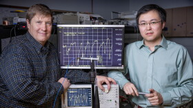 Missouri S&T professors Rex E. Gerald II and Jie Huang with the sensor they are developing that could help screen people for viruses like coronavirus.