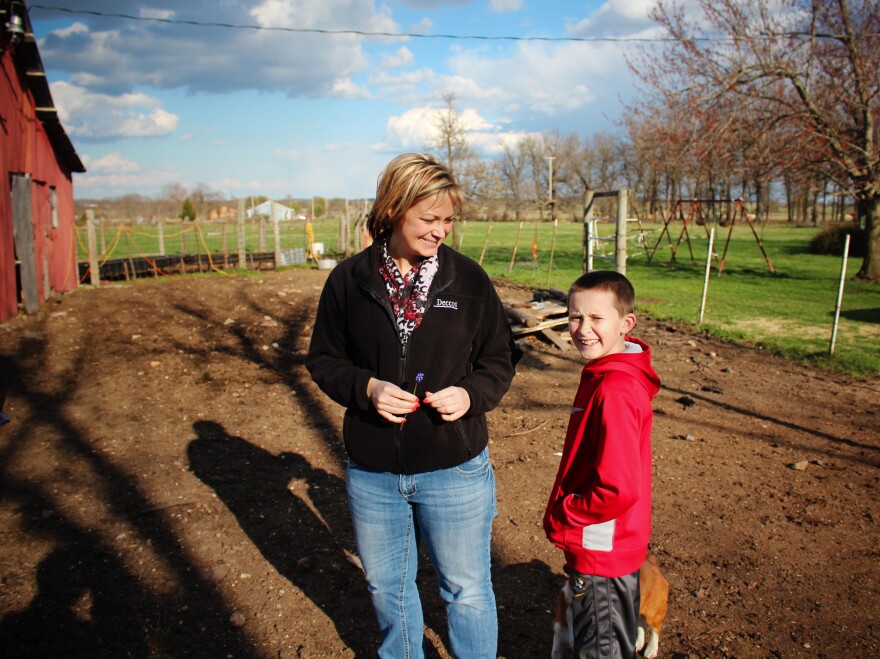 After a day at the office, Devin Fisher and her son Gunnar check on their cattle.