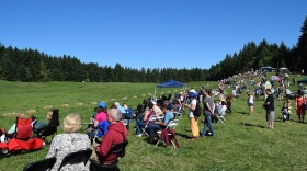 Spectators line one side of the field at the 2015 Vashon Sheepdog Classic. 