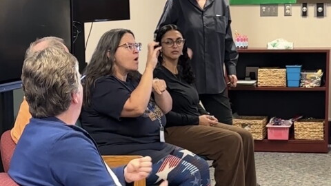 Kristen Sickler, Rochester School for the Deaf alumna and author of the book Siren of the Finger Lakes, presents at an alumni panel discussion with current students at the school's library on Friday.