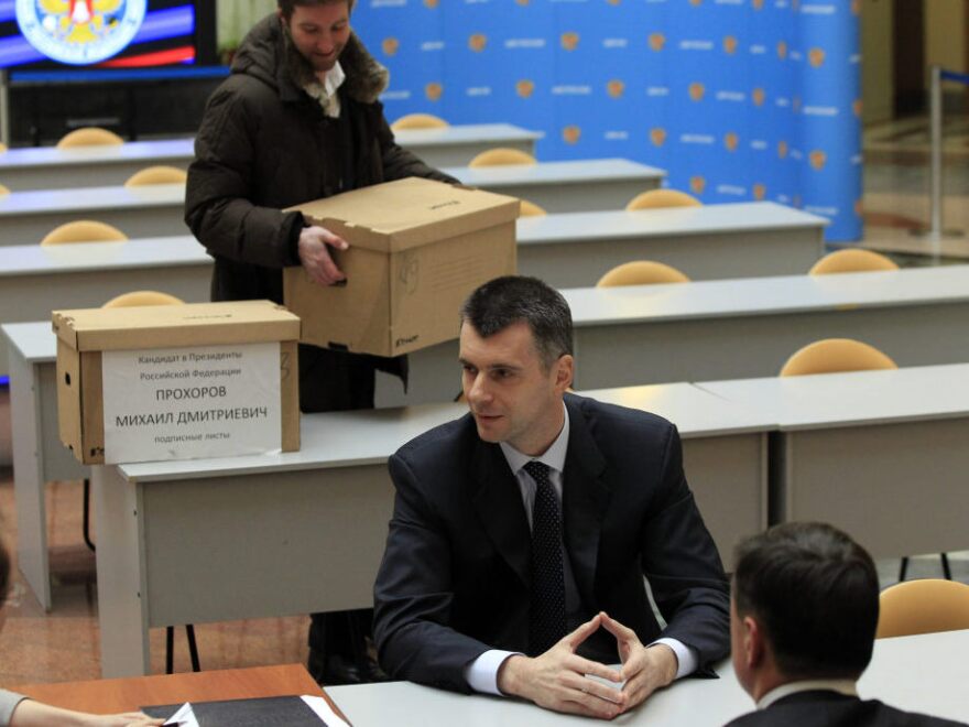 Russian billionaire Mikhail Prokhorov speaks to election officials as he submits documents in the Central Election Commission to officially register as a candidate in March's presidential election.