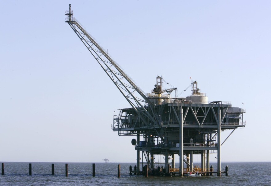 A natural gas platform is shown off the coast of Fort  Morgan, Ala., in 2007. (Rob Carr/AP)