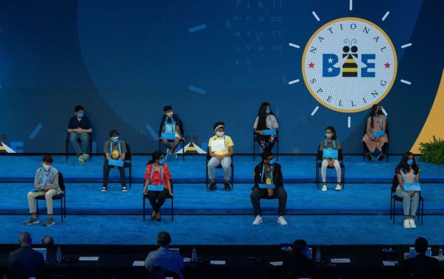 The 11 finalists of the Scripps National Spelling Bee sit on stage as the Finals begins Thursday night.