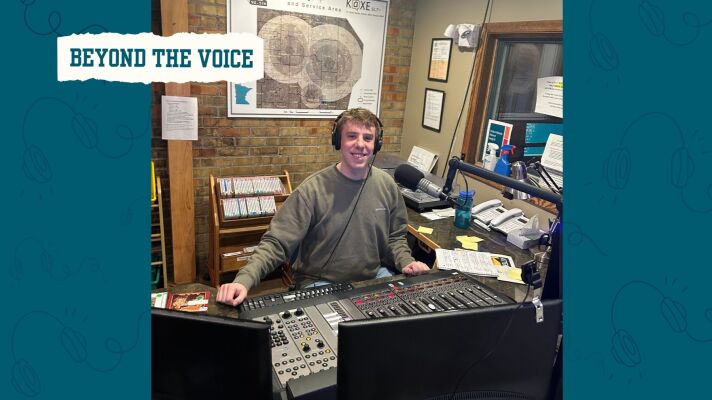 A man smiling at a radio mic 