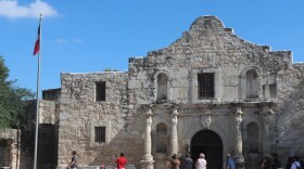Tourists visit the Alamo.