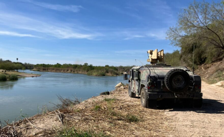 A Humvee is seen parked on the banks of the Rio Grande in Roma, Texas, on Feb. 25. Customs and Border Protection plans to install buoys in this section of the river.