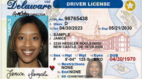 A sample state ID. The white star in the gold circle in the upper right corner denotes it is Real ID compliant.