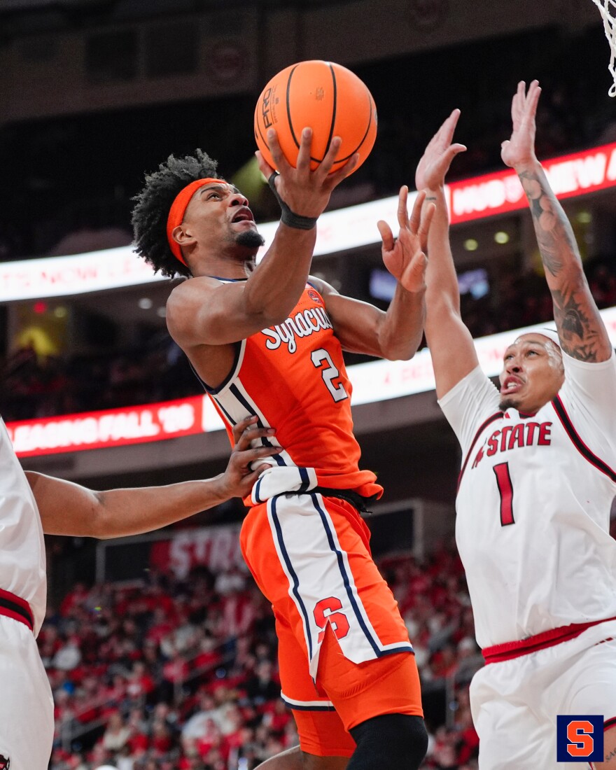 JJ Starling (2, Orange) rises for a layup in Tuesday’s loss to NC State.