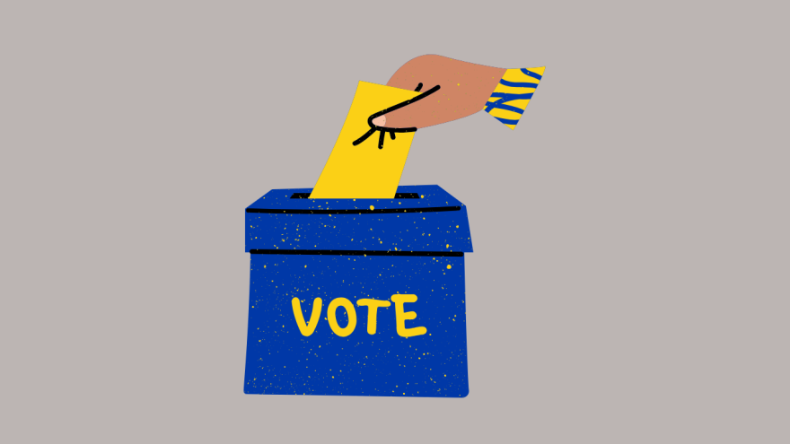 a blue ballot box and a hand casting their vote