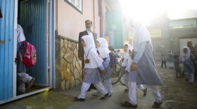 This is something you never would have seen under the Taliban: Girls walking to school.