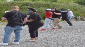 Students at Arm the Populace practice on the range