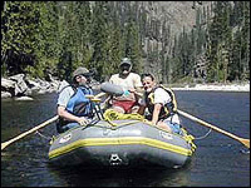 NPR's Elizabeth Arnold, NPR engineer Bill McQuay and river ranger Barry Williams (center) navigate the Selway River.