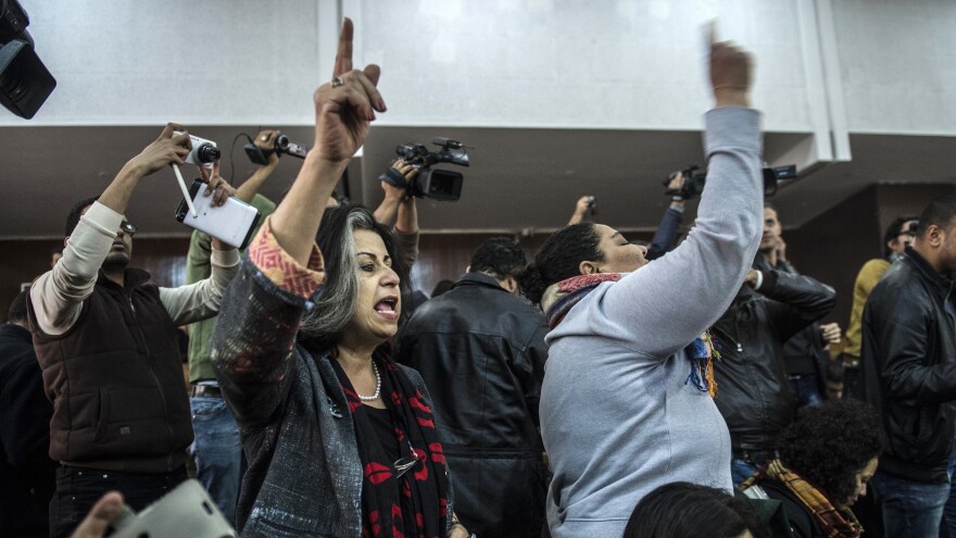 Relatives and supporters of Egyptian activist Alaa Abdel Fattah react after Monday's verdict in a trial over an illegal protest.