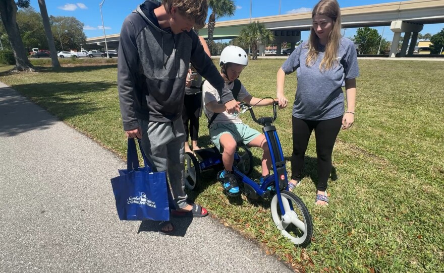 Robbie’s Riders, Grampy’s Charities and Sanibel Captiva Community Bank presented custom-made, adaptive bicycles and tricycles to local special needs children. Eight adaptive tricycles, worth nearly $3,000 each, were given out on Friday, March 20, 2026.