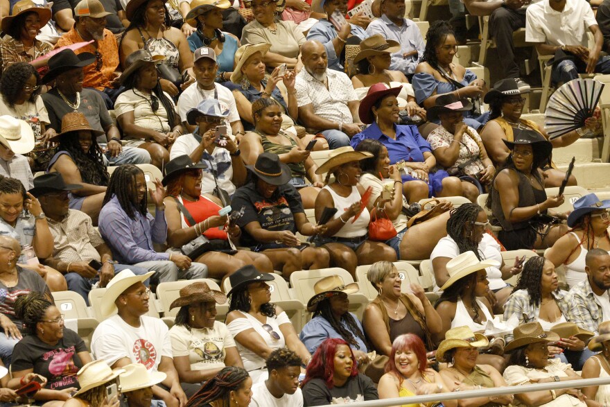 People cheer during Texas Black Invitational Rodeo at Fair Park Coliseum, Saturday, July 26, 2025, in Dallas.