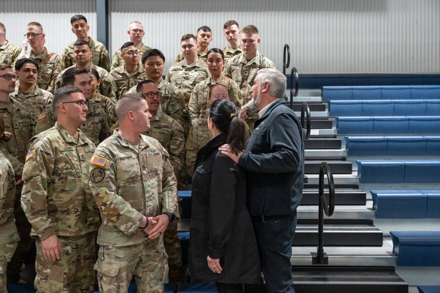 Former Gov. and First Lady Holcomb talk with Indiana National Guard members March 28, 2024, at a departure ceremony for members to be sent to the U.S. southern border.