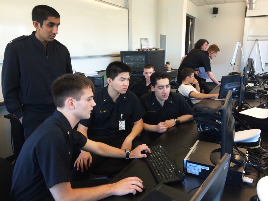 U.S. Naval Academy midshipmen taking part in the cyber exercise check to see if their computer network has been hacked by the NSA's red-cell team.