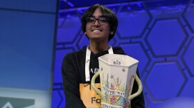 Faizan Zaki, 13, of Dallas, holds the trophy after winning the 2025 Scripps National Spelling Bee at the Gaylord National Resort & Convention Center Thursday, May 29, 2025, in Oxon Hill, Md.