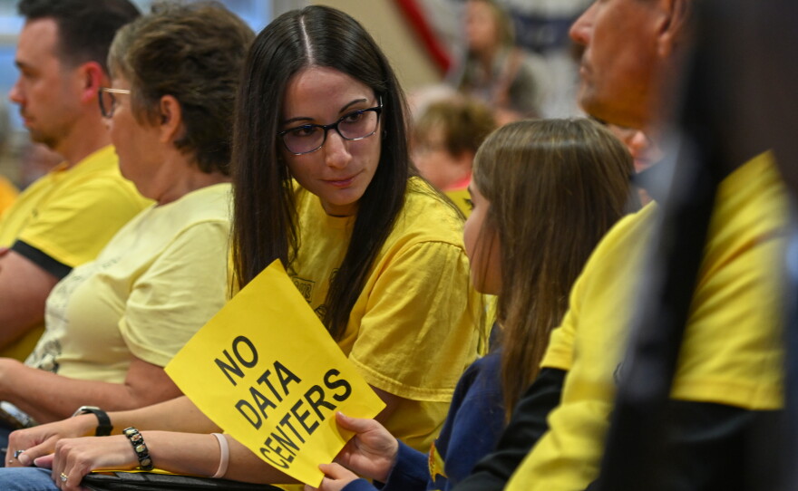 Jermyn resident Janessa Bednash sits with her family during the Archbald Borough Council meeting.