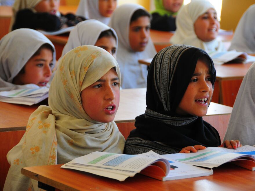 Afghan girls take classes at a refugee school in Afghanistan's Parwan province, on April 3. Under the Taliban, girls were forbidden from receiving an education. Now they account for 40 percent of the country's student enrollment.