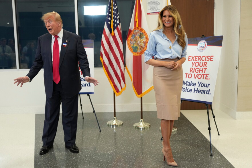 President Donald Trump speaks alongside first lady Melania Trump after casting his early-voting ballot for the 2026 midterm elections at the Palm Beach County Library in West Palm Beach, Fla., Saturday, Oct. 24, 2026. (AP Photo/Mark Schiefelbein)
