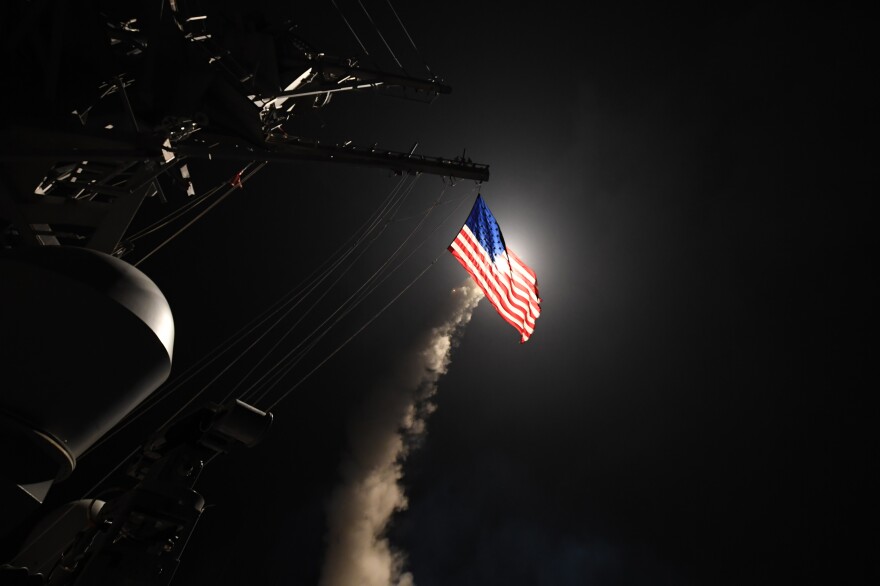 The guided-missile destroyer USS Porter fires a Tomahawk land attack missile on April 7, in the Mediterranean Sea. The Porter was one of two destroyers that fired a total of 59 cruise missiles at a Syrian military airfield in response to a chemical attack that killed scores of civilians.