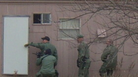 Agents raid a mobile home at Stillwater.