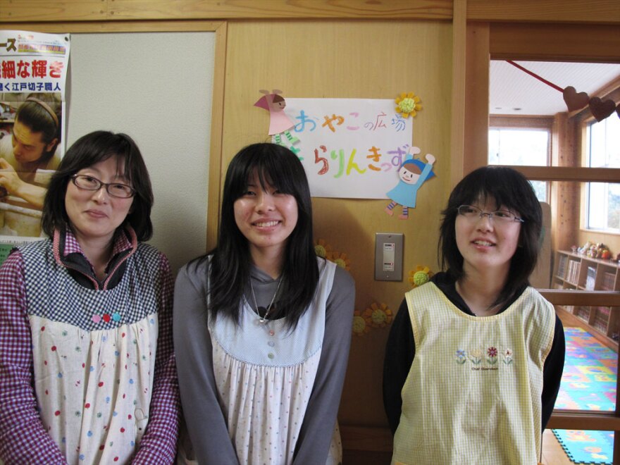 Masako Ito (from left), 15-year-old Mai Kanno and Ito's daughter Shiori stand outside a makeshift day care center they have set up in the library of Rikuzentakata Daiichi Middle School. Masako Ito is trying to give both children and parents a place to find comfort after the disaster.