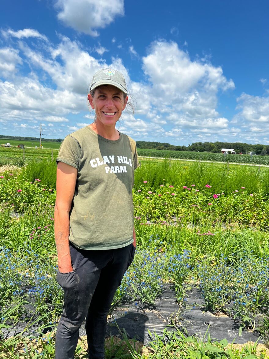 Kristy Buskirk stands at Clay Hill Farm in Tiffin.