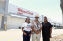 Left to right, Satin Fye, Ronald Frazier and Daniella Pierre stand in front of the shuttered Winn-Dixie in Liberty City.