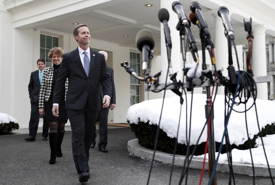 Rep. Jodey Arrington, R-Texas, far left, Rep. Susan Brooks, R-Ind., and Rep. Rodney Davis, R-Ill., approach the microphones to speak to the media, Tuesday, Jan. 15, 2019, after meeting with a group of House Republicans and President Donald Trump at the White House on border security.