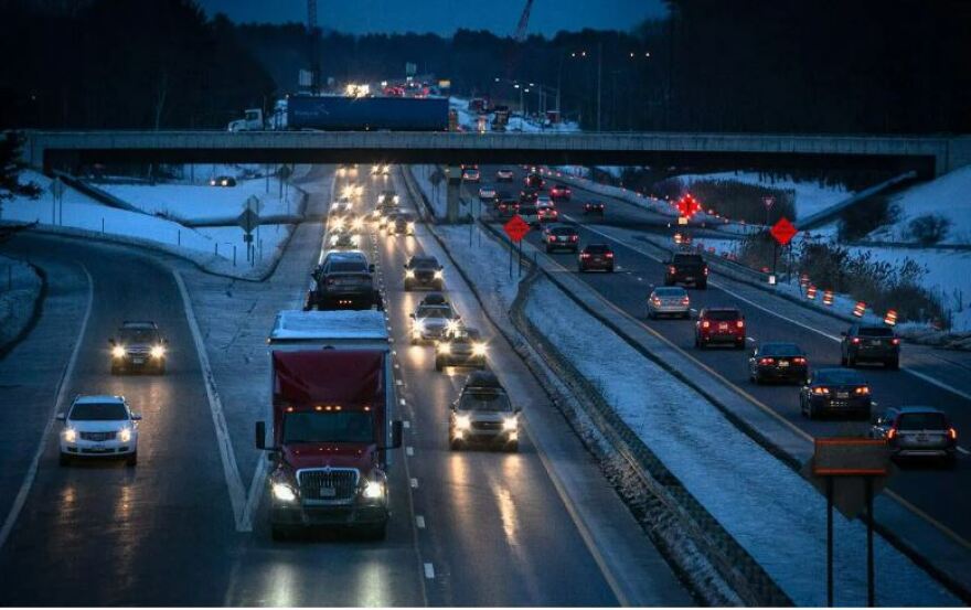 Cars and trucks travel on the Maine Turnpike near exit 48 in Portland.