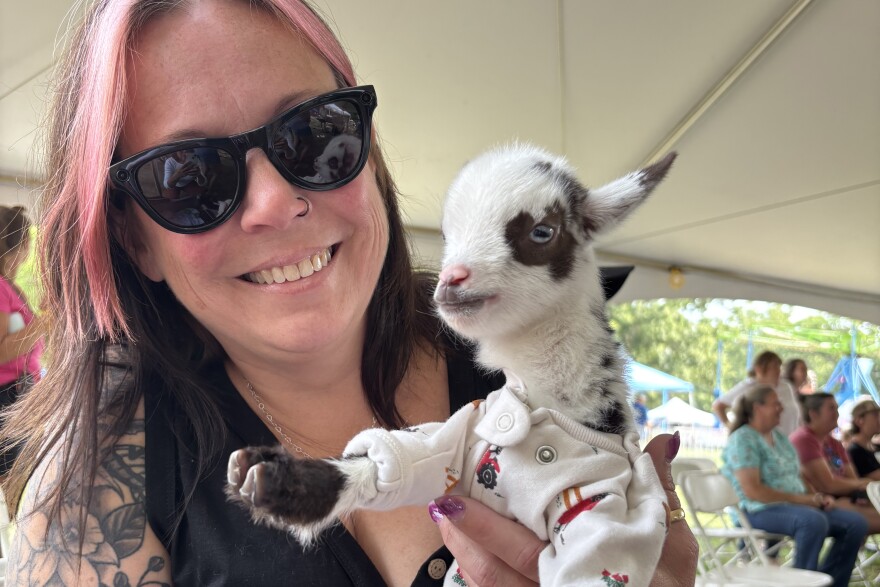 Peanut the pocket goat, just two weeks old, took home a blue ribbon in the pet contest. Here, Peanut poses with his owner, Beaver Dam resident Stephanie Ciejek, a Louisa County substitute teacher and small business owner.